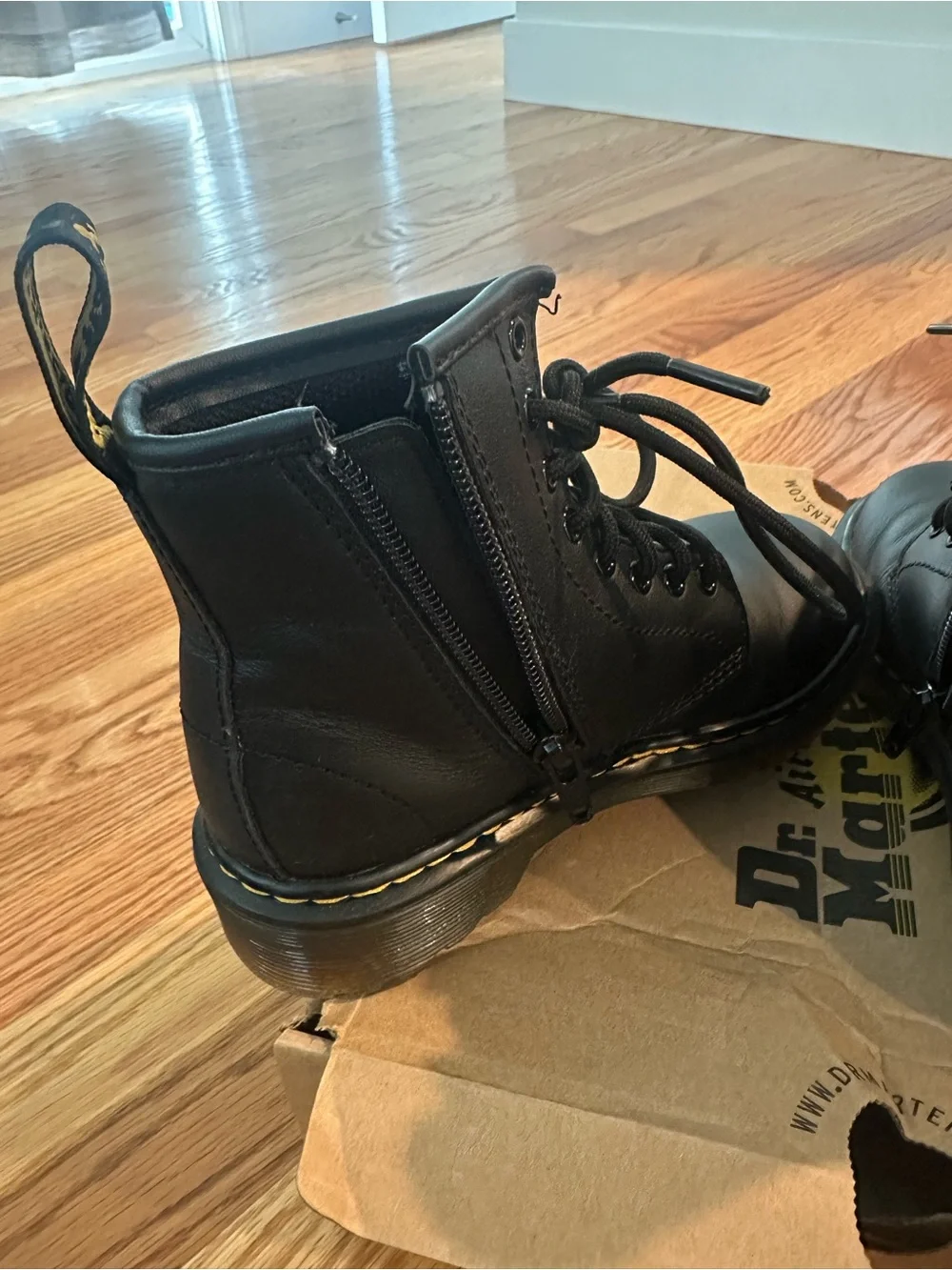 Kids Dr. Martens Black Leather 8-Eye Lace-Up Boots with Yellow Stitching